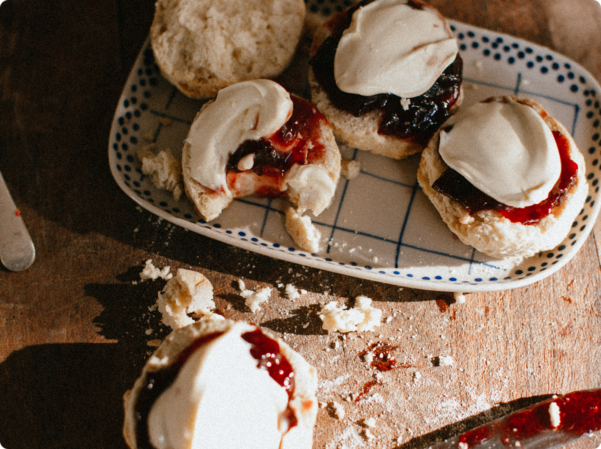 Jam and cream scones on a table